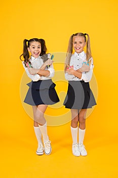 Do it yourself surprise. Happy pupils or young learners. Cute pupils holding creative tools on yellow background. Small
