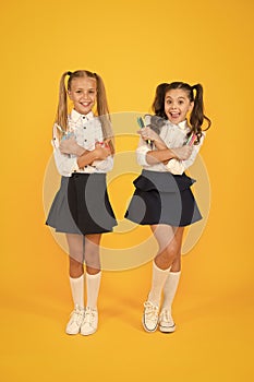 Do it yourself surprise. Happy pupils or young learners. Cute pupils holding creative tools on yellow background. Small