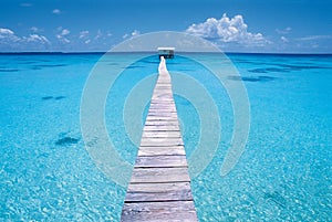 Dock on a blue lagoon, Polynesia