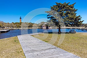 Dock and boardwalk with Curituck Beach Lighthouse in background