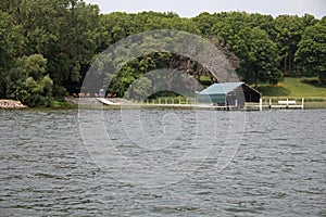 A Dock and a Boat Shelter on a Lake