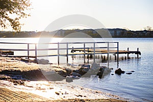 Dock on a cold morning at Lake Granbury at a small beach near the downtown square