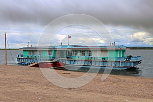 Dock or landing stage on the Yenisei River, dramatic clouds