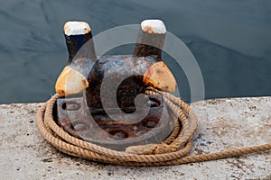 Old Dock Mooring Cleat and Rope at a Harbour Location