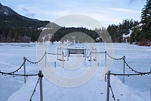 Dock on Nita lake in the winter at Whistler, BC photo
