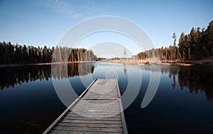 Dock on Northern Manitoba lake photo