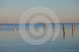 Dock pilings on Penobscot Bay inside the Rockland Breakwater and