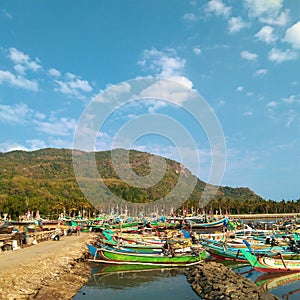 Dock and some of boats beneath a clear sky