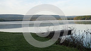 Dock on a still lake in springtime at sunrise