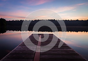 A dock view of on Lake Joseph at dawn.