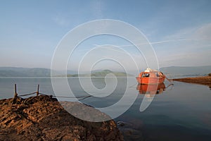 Docked boat at Urumuri lake Satara, Maharastra