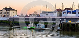 Docked boat with workers in the harbor of Blankenberge, Belgium, popular european city