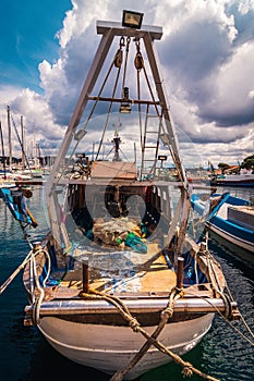 Docked fishing boat at the marina in Sardigna