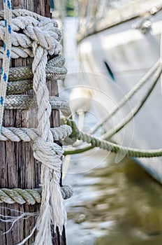 Docked Sailboat and Lines on Pylon photo