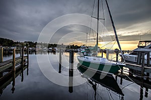 Docked Sailboat With Sunset Horizon