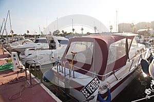 Docked ships in marine bay at Spanish town.