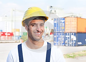 Docker laughing at camera on a seaport