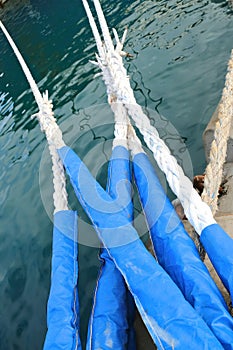 moorings or docking lines in protective covers examples of marine commercial infrastructure photo