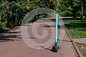 Dockless electric scooters in the city park photo