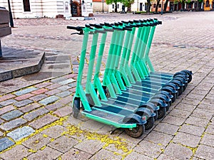 Dockless Electric Scooters on the Sidewalk. Electric scooter economical vehicle in the city for every day photo