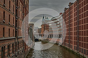 Docks in Hamburg, Germany. Speicherstadt in Hamburg, Germany. Channel and brick buildings in Hamburg