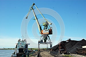 Dockside cargo crane at river port Kolyma