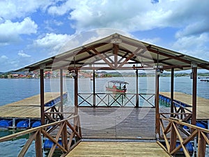 Dockside Serenity on Lake Peten Itza Shoreline, Flores Island, Peten, Guatemala photo