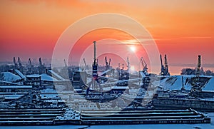 Dockyard winter sunset through the welding glass