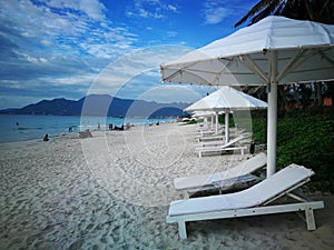 Doclet beach Doc Let in Nha Trang Vietnam. seaside. white sunbeds and umbrellas by the sea