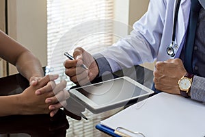 Doctor man or physician talking to patient photo