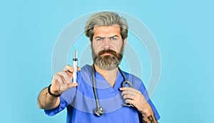 Doctor advertising your product. mature doctor use syringe, selective focus. nurse make injection. flu or influenza