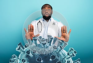 Doctor is afraid due to coronavirus covid-19 attack. Concept of contagion and pandemic. Cyan background photo