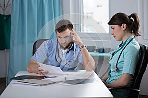 Doctor analsying patient health record