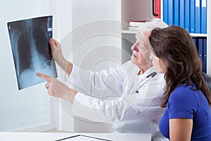 Doctor analyzing x-ray photo