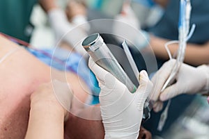 Doctor apply laryngoscope for endotracheal intubation photo