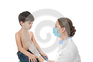 Doctor applying cream onto skin of boy with chickenpox against white background. Varicella zoster virus