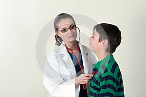 Doctor assessing patient by stethoscope