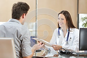 Doctor attending a patient in a consultation