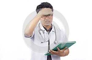 A doctor banging his head realizing a mistake