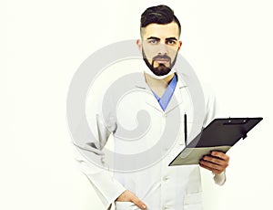 Doctor with beard holds clip folder for prescriptions.