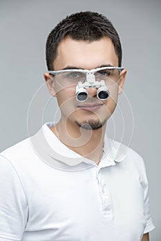 Doctor with binocular loupes