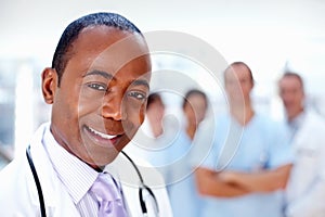 Doctor, black man and portrait of about us with medical, healthcare and clinic staff in a hospital. Teamwork, job and