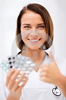 Doctor with blister packs of pills