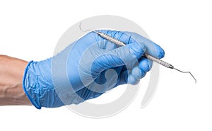 Doctor in blue glove holds dental hook probe in his hands. Isolated on white