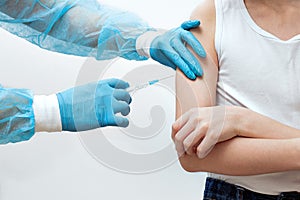 Intramuscular injection, a syringe in the doctorÃ¢â¬â¢s hands photo