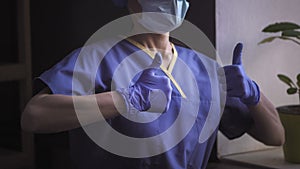 Doctor In Blue Uniform Shows Thumbs Up