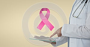 Doctor with breast cancer awareness ribbon