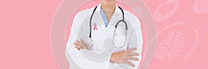 Doctor with breast cancer awareness ribbon