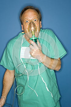 Doctor breathing oxygen