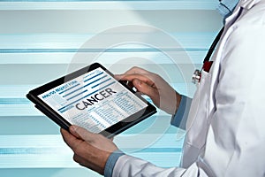 Doctor with a cancer diagnosis in digital medical report